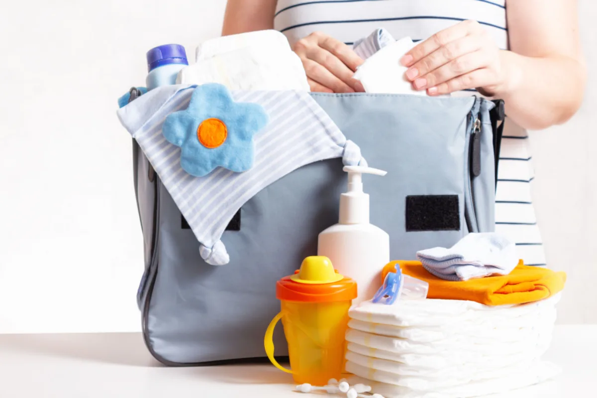 create a calming cover image for a blog article titled Diaper Bag Essentials What You Really (6)