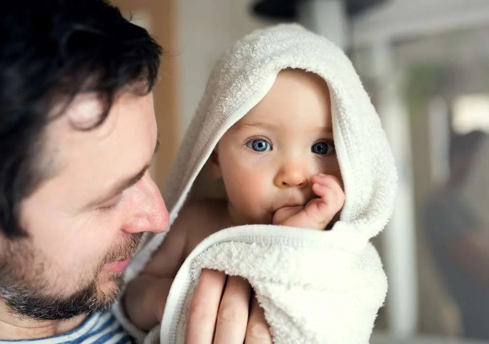dad and baby at bath