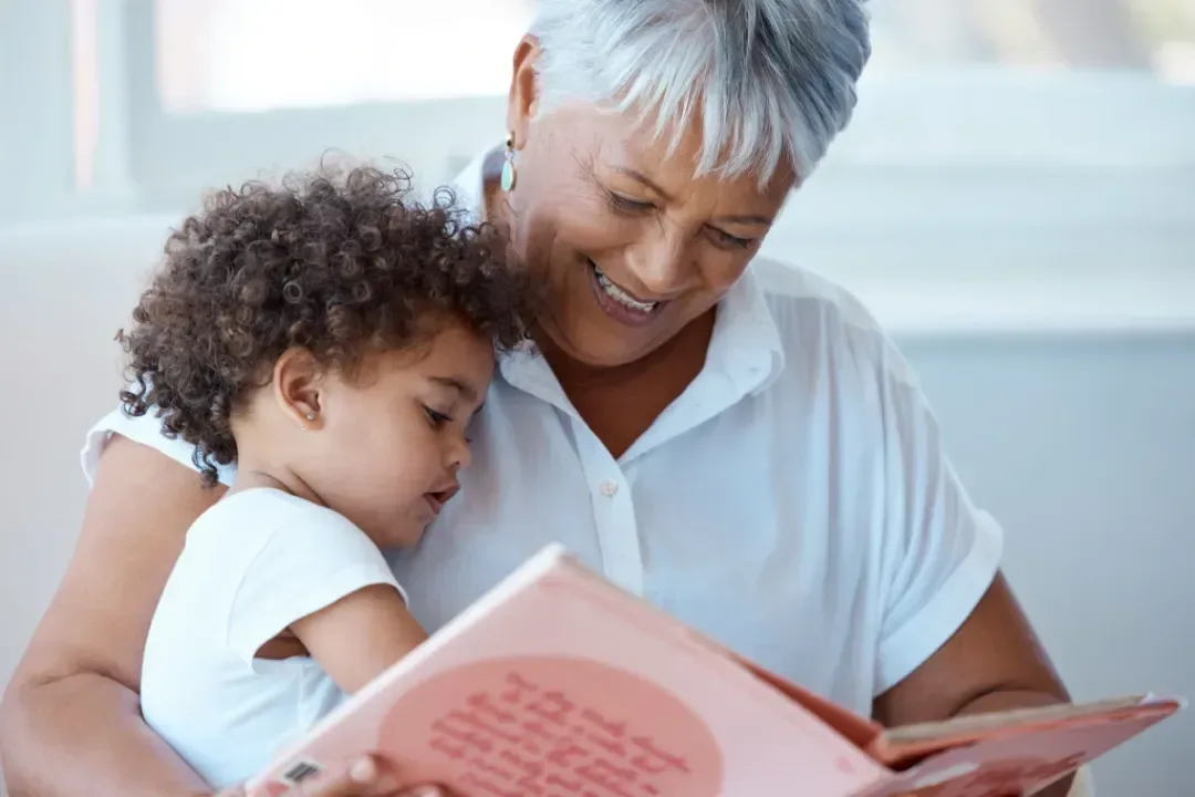 Grandmother reading to grandchild