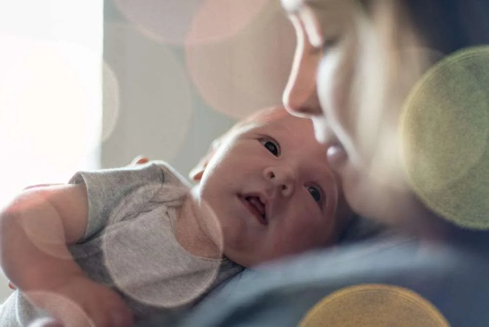 Cute newborn baby serie with pastel bokeh filter