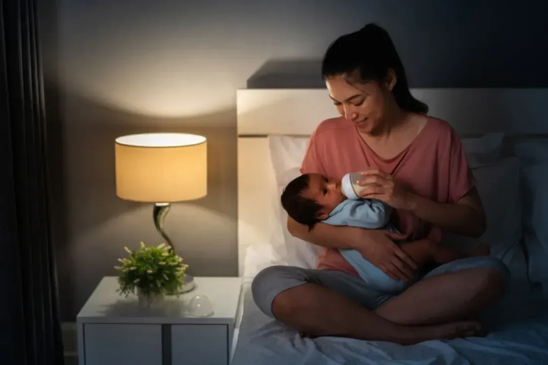 Night Nanny bottle feeding baby