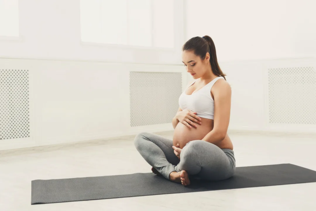 Expecting mother practicing yoga