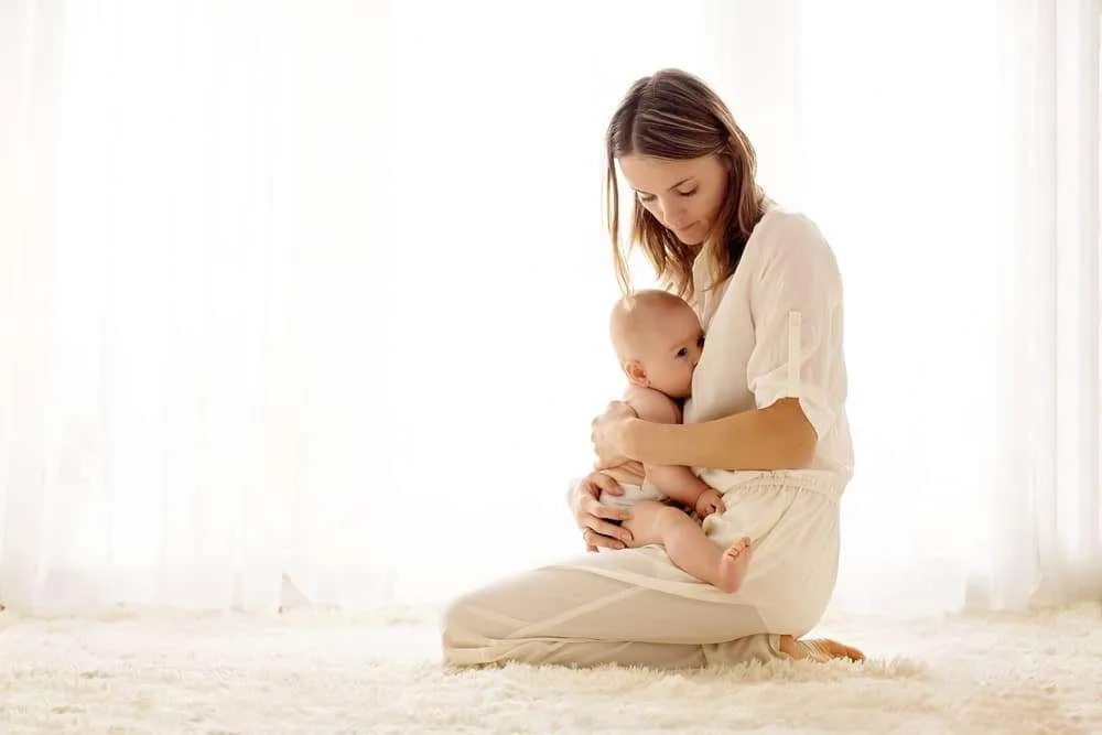 young mom breastfeeding baby